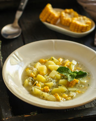 soup with corn and vegetables (cob, first course). top food background. copy space