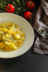 soup with corn and vegetables (cob, first course). top food background. copy space