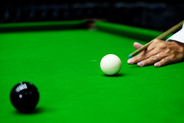Game snooker billiards or opening frame player ready for the ball shot, athlete man kick cue on the...