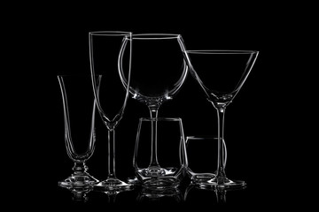 Glassware silhouettes on black.