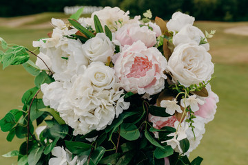 Wedding flowers closeup. Decoration made of roses and decorative plants