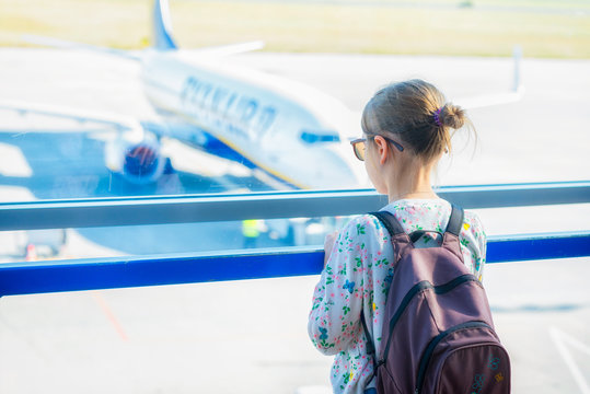 A Little Girl Waiting On The Observation Deck At The Airport