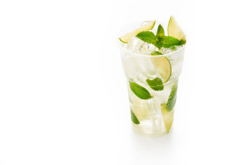 Mojito cocktail with lime and mint in plastic cup on white background