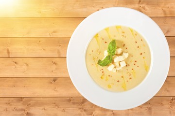 Tasty Squash Soup on background