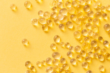 Silica gel granules over yellow background. Silicon moisture