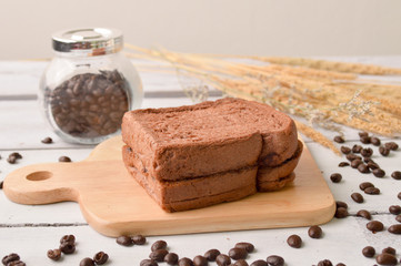 Coffee Bread and Coffee Bean for breakfast on wooden background