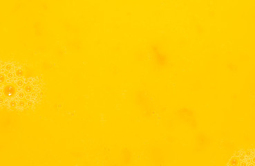 Whipped yolk with eggs as an abstract background
