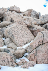 snowy rocks on mountain peak