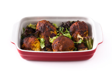 Roasted tandoori chicken with herbs isolated on white background