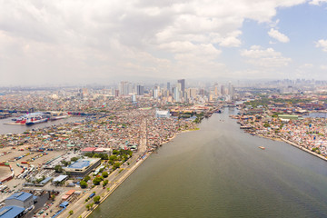 Cityscape Manila. Residential areas and business center in the city, top view. Big port city. The...