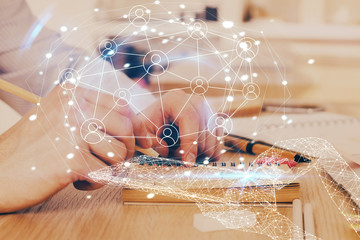 Man's hands working with notes background. Social networking scheme . Mixed media