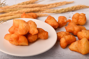Chinese traditional food, deep fried bread stick normally eaten with rice porridge ,white sugar sponge cake, 