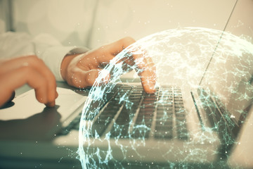 Social network theme hologram with businessman working on computer on background. Concept of world wide web. Double exposure.