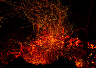Fototapeta na wymiar Nice fire sparkle trails background, like volcanic