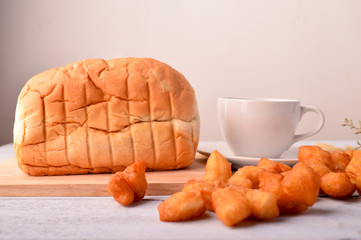 Chinese traditional food, deep fried bread stick normally eaten with rice porridge ,white sugar sponge cake, 