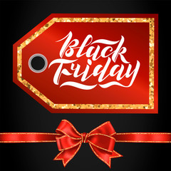 Handwritten modern brush lettering for Black Friday sale on a tag with red bow and glitter. Cool logo for banner, flyer, label, poster