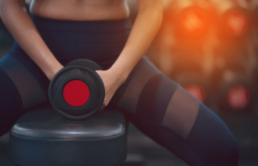 Fototapeta na wymiar Women exercising in the gymDark tone with orange light Abstract style