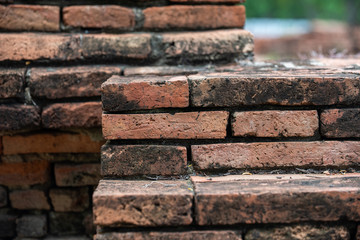 Details and closeup of red old and vintage style bricks from a historic architecture in Ayutthaya Historical Park, Ayutthaya Province, Thailand, Asia.