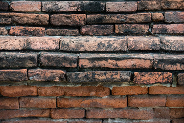 Details and closeup of red old and vintage style bricks from a historic architecture in Ayutthaya Historical Park, Ayutthaya Province, Thailand, Asia.