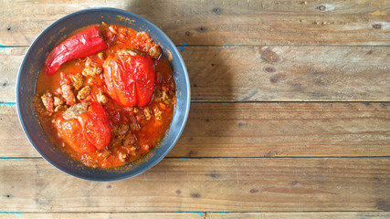 filled, barbecued bell pepper with meatballs and tomato sauce
