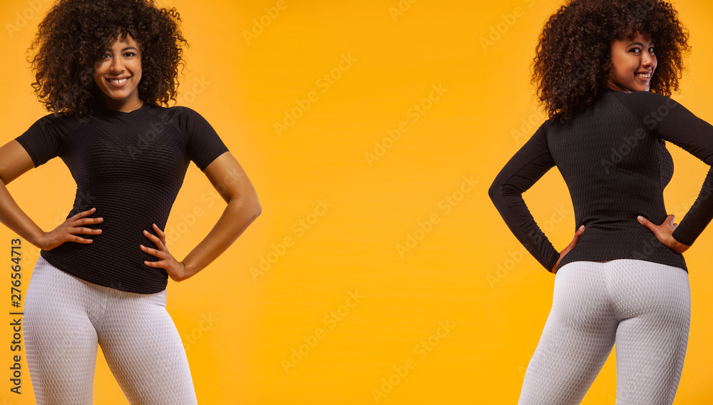 Wall mural Strong athletic woman with black skin and curly hair, posing on yellow background wearing sportswear. Fitness and sport motivation. Catalogue example.