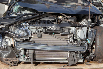 Front of car gets damaged by accident on the road
