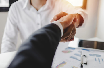 Fototapeta na wymiar Partnership. two business people shaking hand after business signing contract in meeting room at company office, job interview, investor, success, negotiation, partnership, teamwork, financial concept