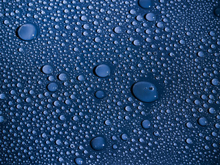 Water drops on blue background.