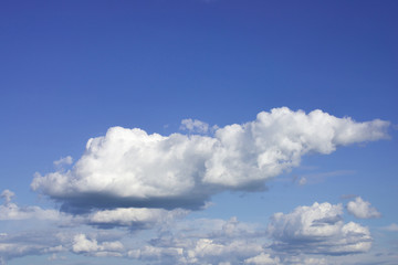 Naklejka na ściany i meble Cumulus clouds on a summer day