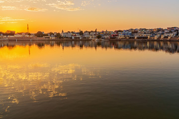 Ghats at Pushkar lake at sunset in Rajasthan. India