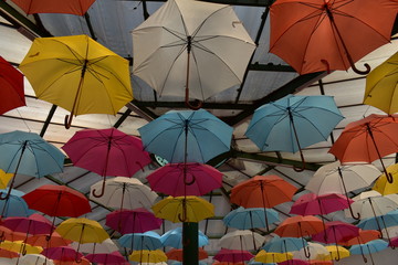 Fototapeta na wymiar colorful umbrellas on a background of blue sky