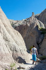 Man Hiking in a Desert Canyon