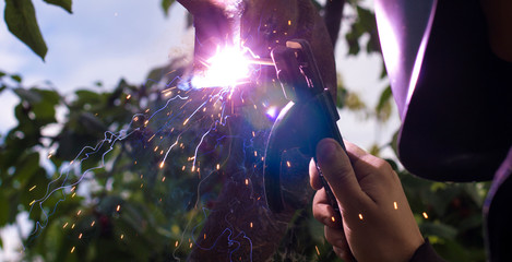 glare and sparks from welding, in nature