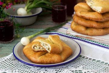 Traditional homemade Romanian and Moldovan pies - Placinta, served with wine. Rustic style.