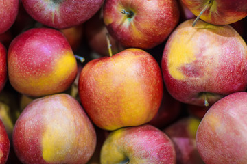 Lots of fresh delicious red apples as background