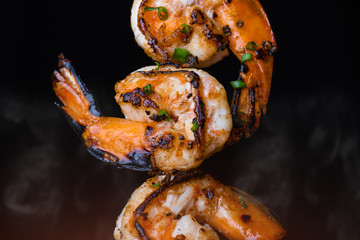 Skewer shrimps burnt grilled with spice seasoning.