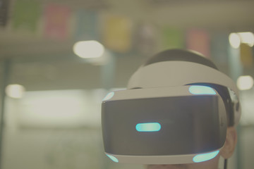 A kid wear VR (virtual reality) mask.