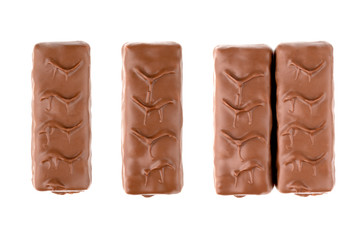 Chocolate bar on a white background. Candy with peanuts and nougat in chocolate close-up.