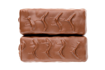 Chocolate bars on a white background. Sweets with peanuts and nougat in chocolate close-up.