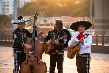 Mexican musicians mariachi band street concert