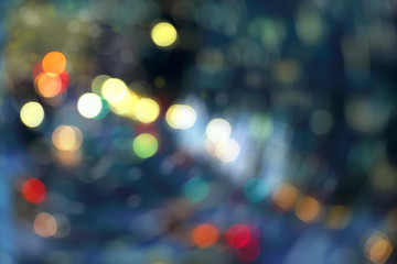 Blurry background image of defocused colorful abstract city street lights at night