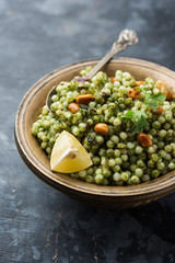Hariyali sabudana khichdi is a delicious twist to the regular Sago khichadi made using cilantro , chillies and groundnuts