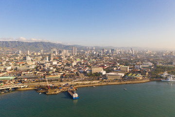 Cityscape in the morning. The streets and houses of the city of Cebu, Philippines, top view. Panorama of the city with houses and business centers.
