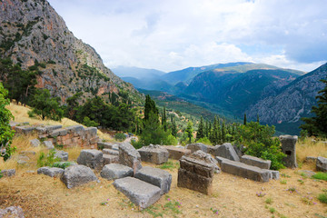 Fototapeta na wymiar Ruins of ancient greek city Delphi with beautiful mountain landscape of Greece on the background
