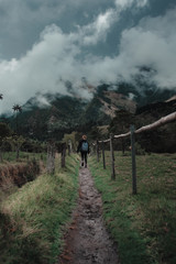 Woman hiking through a mountainous area