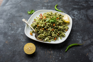 Hariyali sabudana khichdi is a delicious twist to the regular Sago khichadi made using cilantro , chillies and groundnuts