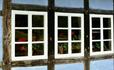 Old dark windows, a close look. Architecture of Europe. Middle ages.