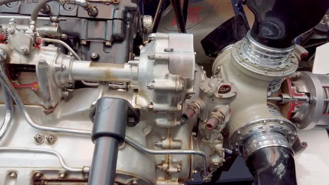 Aero engine detail.  Close up tracking shot of a Merlin airplane engine.