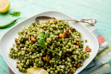 Hariyali sabudana khichdi is a delicious twist to the regular Sago khichadi made using cilantro , chillies and groundnuts