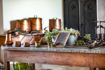Decorated table ith plants and cookware